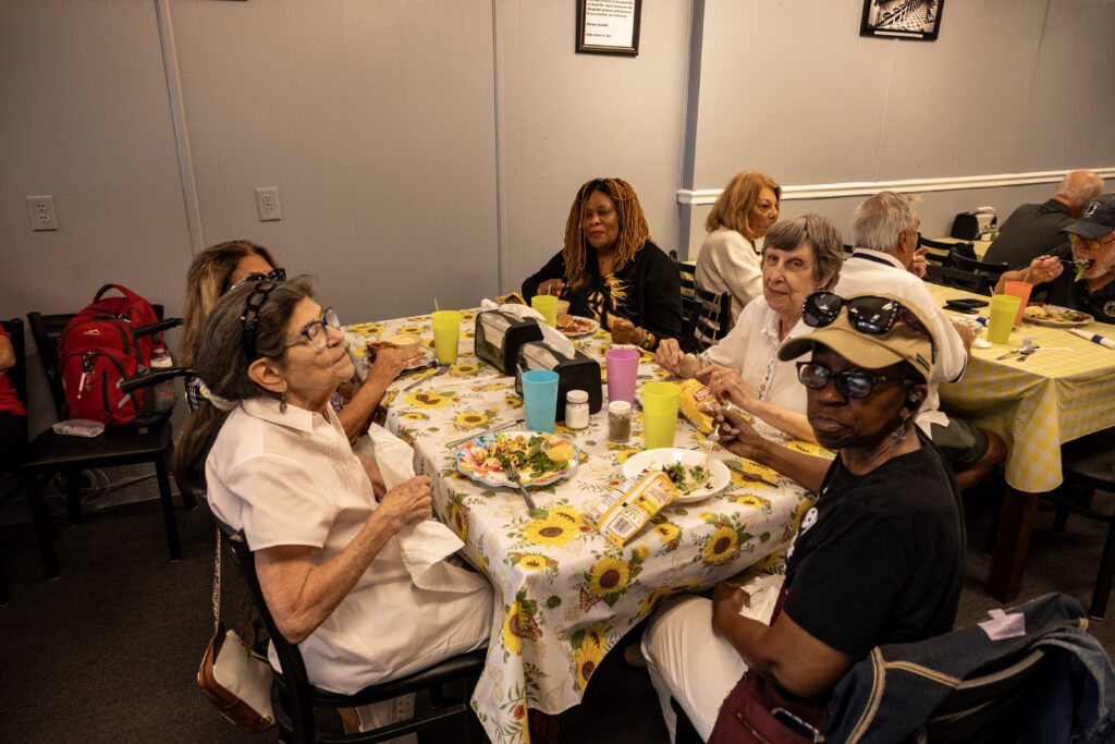 Clients from New Vision enjoy lunch at Ellen's Cafe in downtown Leesburg before going to the library for the Wings of Liberty event.
